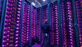 It engineer / consultant working in a data center. This enclosures is a SAN (storage area network) and servers Royalty Free Stock Photo