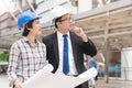 Group of happy builder construction people talking and planning work schedule. Royalty Free Stock Photo