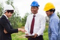 Engineer, contractor, worker teamwork. Group of construction people look at blueprint together  and planning work schedule Royalty Free Stock Photo