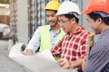 Engineer, contractor, worker teamwork. Group of construction people look at blueprint together  and planning work schedule Royalty Free Stock Photo