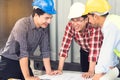 Engineer, worker teamwork. Group of construction people look at blueprint together  and planning work schedule Royalty Free Stock Photo