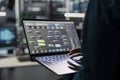 Engineer in data center uses AI on laptop for machine learning workloads Royalty Free Stock Photo