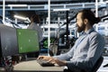 Engineer in data center using green screen mockup PC to update software Royalty Free Stock Photo