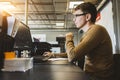 Engineer designer working on desktop computer in factory