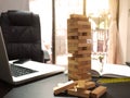 Engineer desk with a blocks wood tower game. plan construction Royalty Free Stock Photo