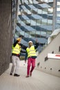 Engineer discussing the structure of the building with architects colleague at construction site There is a problem Royalty Free Stock Photo