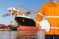 Engineer dockers wearing safety coat and holding a helmet Royalty Free Stock Photo