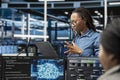 Engineer does monitoring in server hub supporting AI workloads Royalty Free Stock Photo