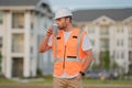 Engineer drinking take away coffee on break. Engineer drinking take away coffee on break. Builder on site construction Royalty Free Stock Photo