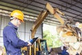 Engineer driving a loader in the recycling plant. Factory recycle workers are using a tablet to control work in the recycling Royalty Free Stock Photo