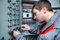 Engineer electrician fixes problems in the electrical panel.