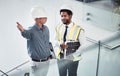 Engineer, electrician or team talking energy for construction project management. Diversity men together on office Royalty Free Stock Photo