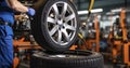 An Engineer Expertly Balancing a Car Wheel on a Workshop Balancer