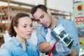 engineer in factory with apprentice checks component quality Royalty Free Stock Photo