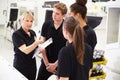 Engineer In Factory With Apprentices Checking Components Royalty Free Stock Photo