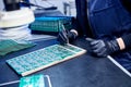 Engineer factory worker electronics works with a chip board. Microchip Production, Nano computer Technology and manufacturing Royalty Free Stock Photo