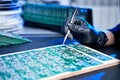 Engineer factory worker electronics works with a chip board. Microchip Production, Nano computer Technology and manufacturing Royalty Free Stock Photo