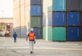 Engineer and factory worker team walking in the cargo container Royalty Free Stock Photo
