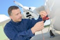 Engineer filling plane with furl Royalty Free Stock Photo