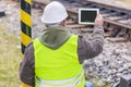 Engineer filmed the railway with tablet PC Royalty Free Stock Photo