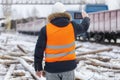 Engineer filmed on the tablet PC near the freight wagons Royalty Free Stock Photo