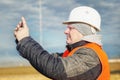 Engineer filmed with tablet PC at outdoors Royalty Free Stock Photo