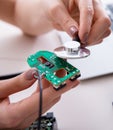 Engineer fixing broken computer hard drive Royalty Free Stock Photo