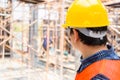 Engineer / foreman checking and planning project at construction site Royalty Free Stock Photo