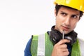 Engineer or foreman in hardhat thinking of work in factory or site. Engineer or professional contractor hold pen. Business