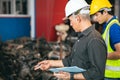 Engineer foreman manager working check stock with young male staff worker