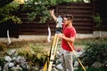 engineer in garden elevation construction site using and working with theodolite Royalty Free Stock Photo