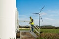 Engineer and geologist consult close to wind turbines in the countryside Royalty Free Stock Photo