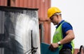 Engineer in hardhat on stacker lifting container control loading containers box, Dock worker man with clipboard checklist on