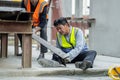 An engineer has an accident where steel falls on his leg at work, causing serious leg injuries. and get help from colleagues in