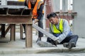 An engineer has an accident where steel falls on his leg at work, causing serious leg injuries. and get help from colleagues in