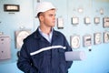 Engineer with helmet and blueprints at control room Royalty Free Stock Photo