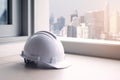 Engineer helmet is putting with architect building at the background as for industrial