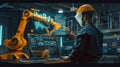 An engineer in a high-tech manufacturing setting is programming or operating advanced automated machinery using a Royalty Free Stock Photo