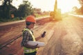 Engineer holding blueprint in construction site Royalty Free Stock Photo