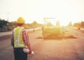 Engineer holding blueprint in construction site Royalty Free Stock Photo