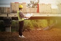 Engineer holding blueprint in construction site Royalty Free Stock Photo