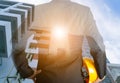 Engineer holding a hat and designing building Conceptual Royalty Free Stock Photo