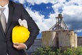 Engineer holding helmet for working at footing of building Royalty Free Stock Photo