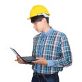 Engineer while holding using Laptop and head wear white safety helmet plastic.Concept Work construction on white background Royalty Free Stock Photo