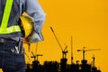 Engineer holding yellow helmet Royalty Free Stock Photo