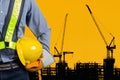 Engineer holding yellow helmet Royalty Free Stock Photo