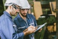 Engineer industry worker work help together training new young employee teamwork in metal factory Royalty Free Stock Photo