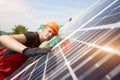 Engineer inspecting solar energy panels near house. Close up