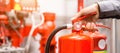 Engineer inspection Fire extinguisher in control room Royalty Free Stock Photo