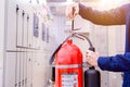 Engineer inspection Fire extinguisher in control room Royalty Free Stock Photo